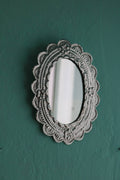 Small oval mirror